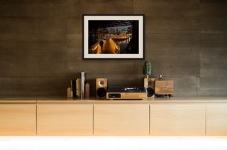 Darling Harbour, Sydney | Lone figure in rain | 2026 shown in a room